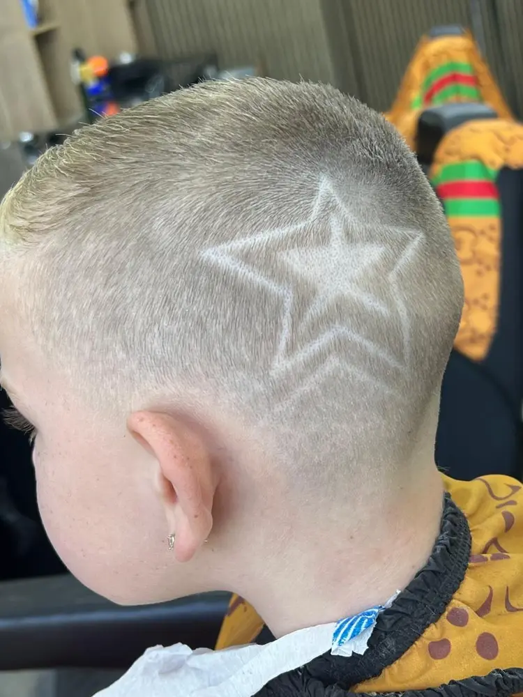 Star hair design shaved into a fade